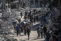 Hình ảnh người dân Palestine trở về khu phố đổ nát ở Gaza