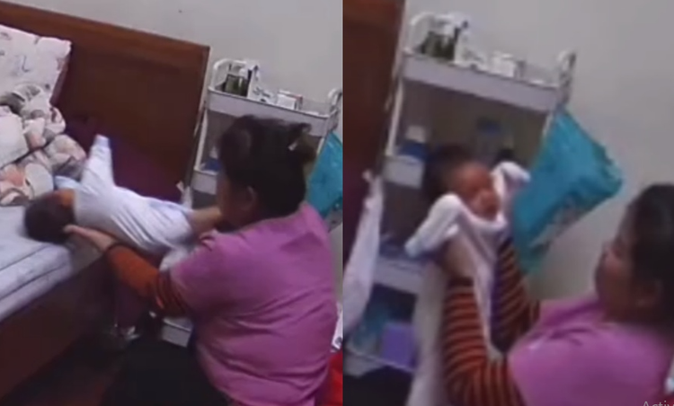 Nữ bảo mẫu nhiều lần có hành động đẩy cháu bé ra giường, sốc thẳng lên, lắc lư mạnh. Ảnh cắt từ clip.