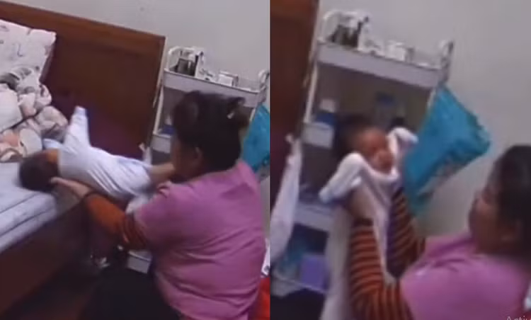 Nữ bảo mẫu nhiều lần có hành động đẩy cháu bé ra giường, sốc thẳng lên, lắc lư mạnh. Ảnh cắt từ clip.