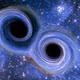 Hai hố đen siêu khối lượng đang hợp nhất