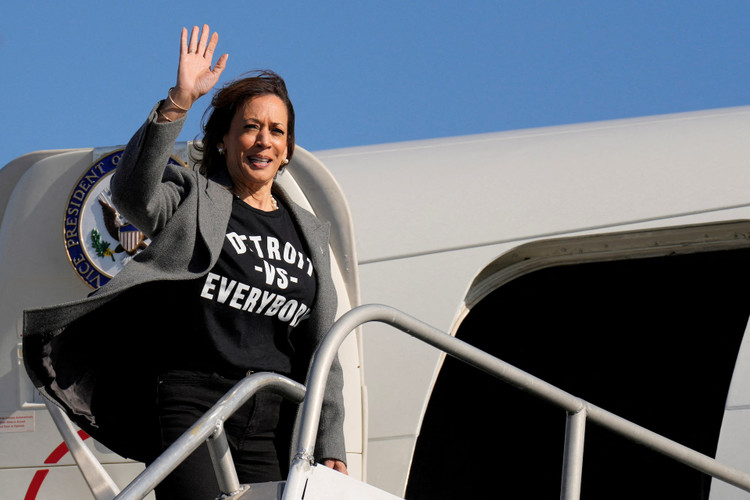 Democratic presidential nominee Vice President Kamala Harris waves as she boards Air Force Two at Detroit Metropolitan Wayne County Airport, in Detroit