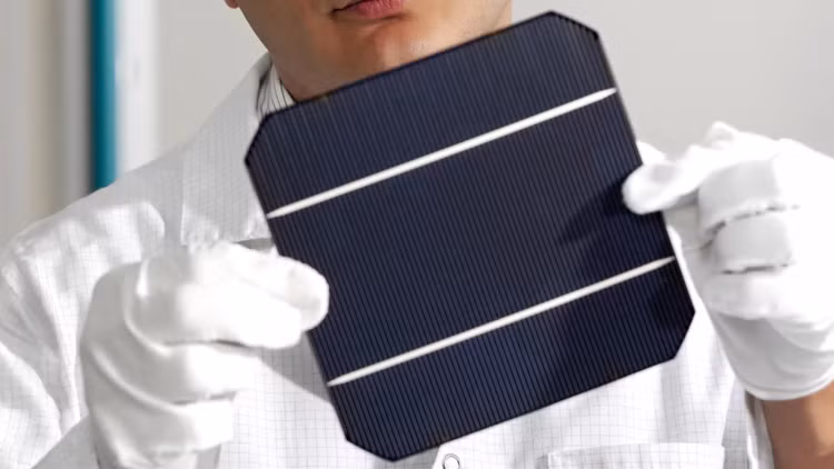 inspecting-new-solar-cell.jpg
