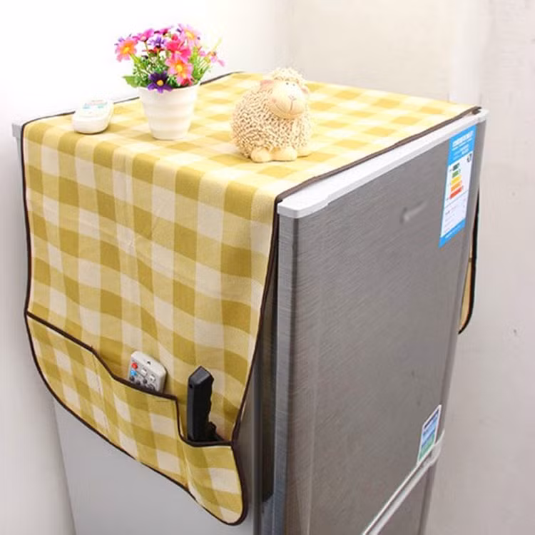 Tuyệt đối không đặt tấm vải phủ lên nóc tủ lạnh. Ảnh minh họa