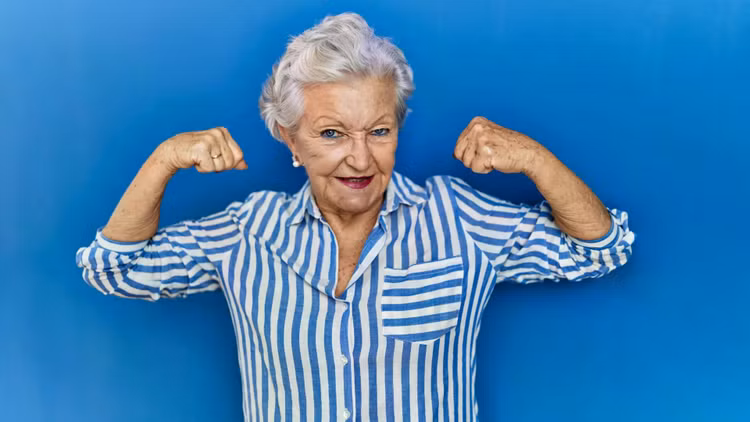 senior-woman-flexing-muscles.jpg