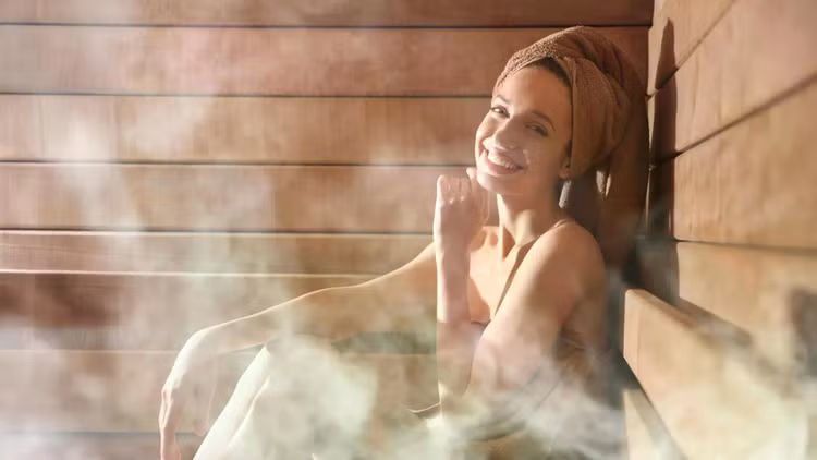 smiling-woman-relaxing-in-steam-sauna.jpg