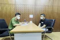 Trần Minh Tuấn tại cơ quan công an.