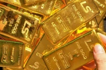 Vàng thế giới vượt mốc 1.600 USD/oz, cao nhất 7 năm