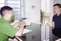 Trần Xuân Kiên tại cơ quan công an.