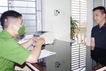 Trần Xuân Kiên tại cơ quan công an.