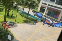 Phát hiện thi thể người đàn ông ở sân chung cư sau tiếng động mạnh