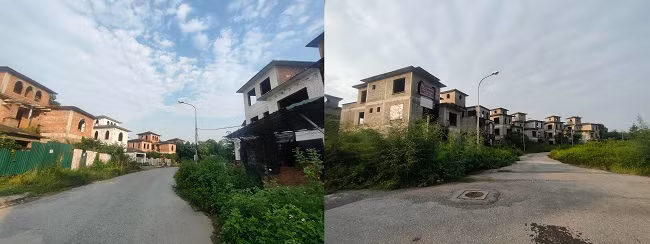 Đường vào khu biệt thự này vắng bóng người ra vào, cỏ mọc um tùm hai bên lối đi.