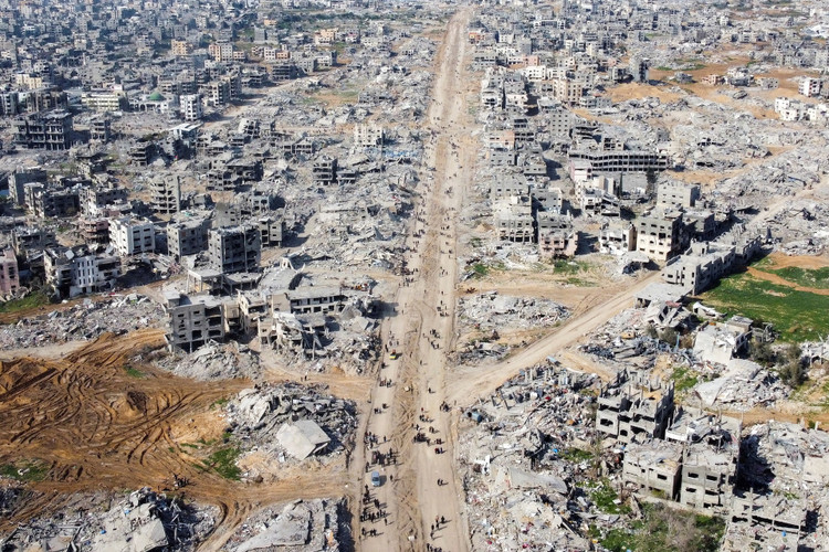 A drone view shows houses and buildings lying in ruins, following a ceasefire between Israel and Hamas, in the northern Gaza Strip