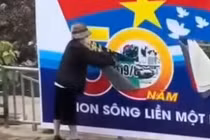 Xác định người phụ nữ rạch banner chào mừng Ngày Giải phóng miền Nam